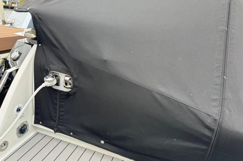 Slide: The Image of 2023 Formula 400 Super Sport Crossover with black cover and power connection. - 5