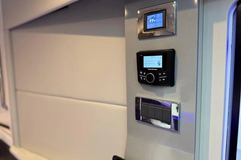 Slide: The Image of 2023 Formula 400 Super Sport Crossover interior control panel with digital displays. - 54