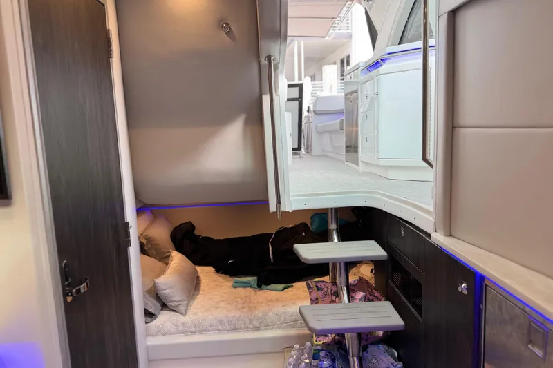 Slide: The Image of 2023 Formula 400 Super Sport Crossover interior cabin with modern design and cozy sleeping area. - 55