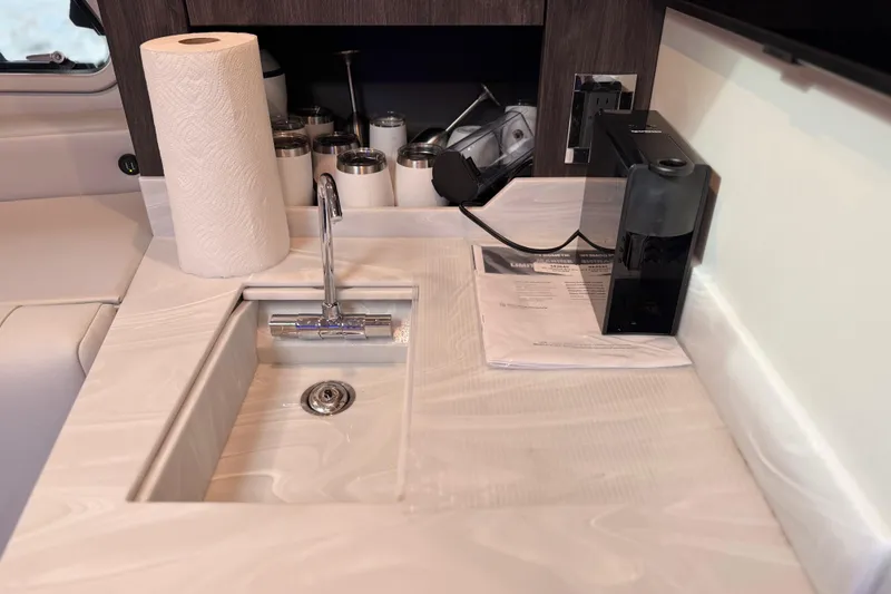 Slide: The Image of Modern kitchen sink area in 2023 Formula 400 Super Sport Crossover boat. - 63