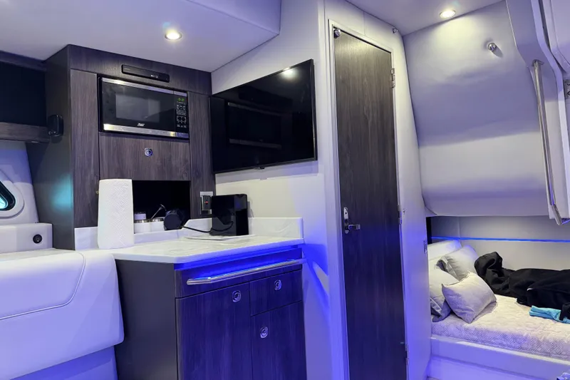 Slide: The Image of Interior of 2023 Formula 400 Super Sport Crossover with modern kitchen and cozy sleeping area. - 66