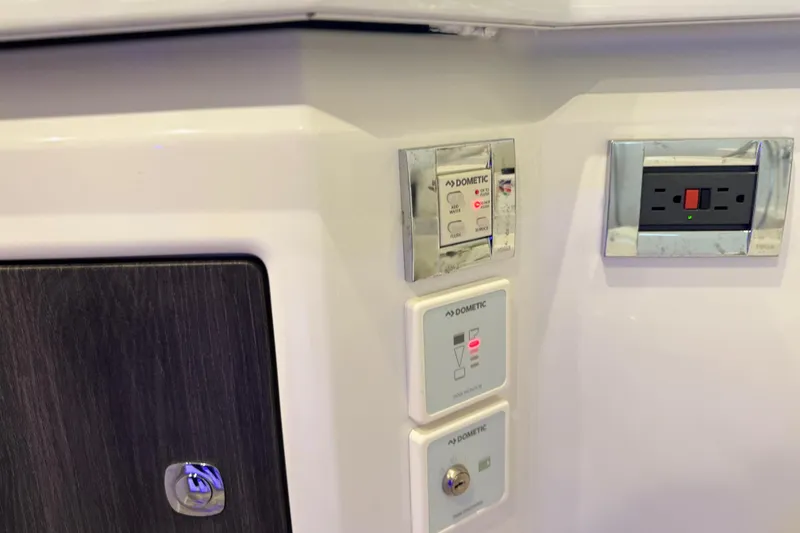 Slide: The Image of Control panel and outlet on 2023 Formula 400 Super Sport Crossover boat interior. - 67
