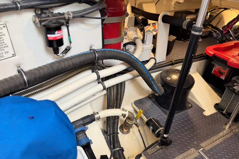 Slide: The Image of Engine compartment of 2023 Formula 400 Super Sport Crossover with hoses and equipment. - 75