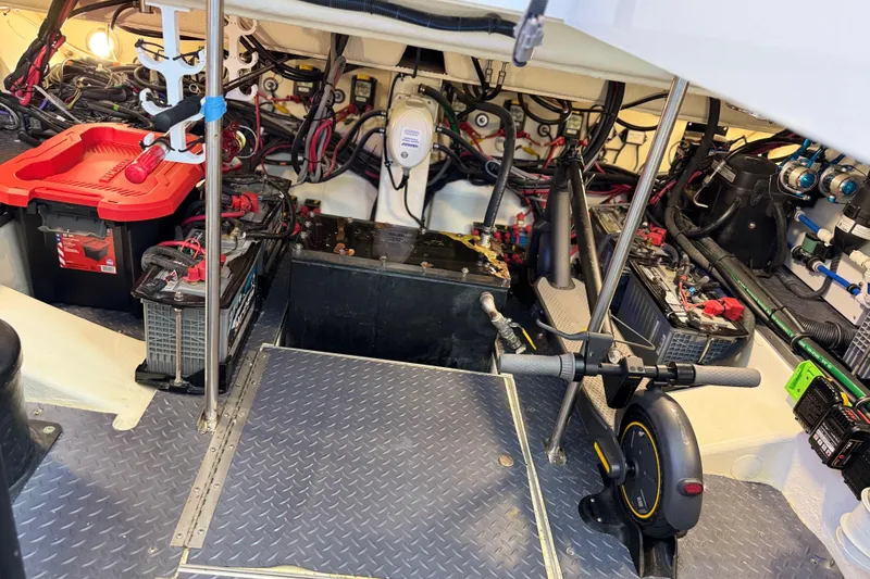 Slide: The Image of Engine room of 2023 Formula 400 Super Sport Crossover with batteries and wiring. - 76