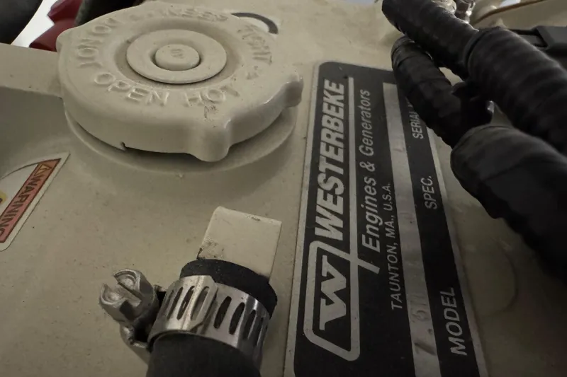 Slide: The Image of Close-up of Westerbeke engine components in a 2023 Formula 400 Super Sport Crossover. - 86