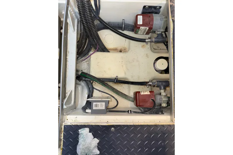 Slide: The Image of Engine compartment of 2023 Formula 400 Super Sport Crossover with visible wiring and components. - 88