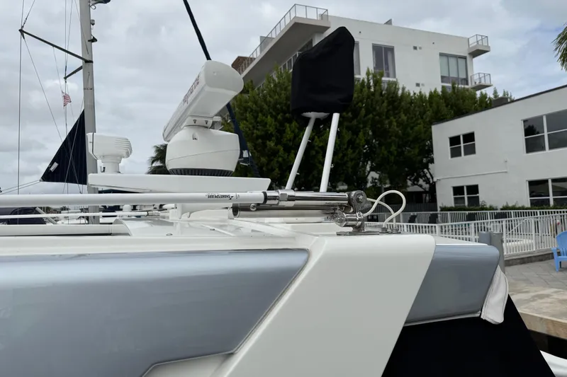 Slide: The Image of 2023 Formula 400 Super Sport Crossover yacht docked near modern buildings. - 9
