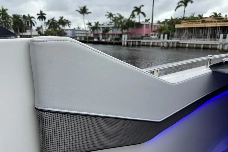 Slide: The Image of 2023 Formula 400 Super Sport Crossover boat detail with sleek design and waterfront view. - 90