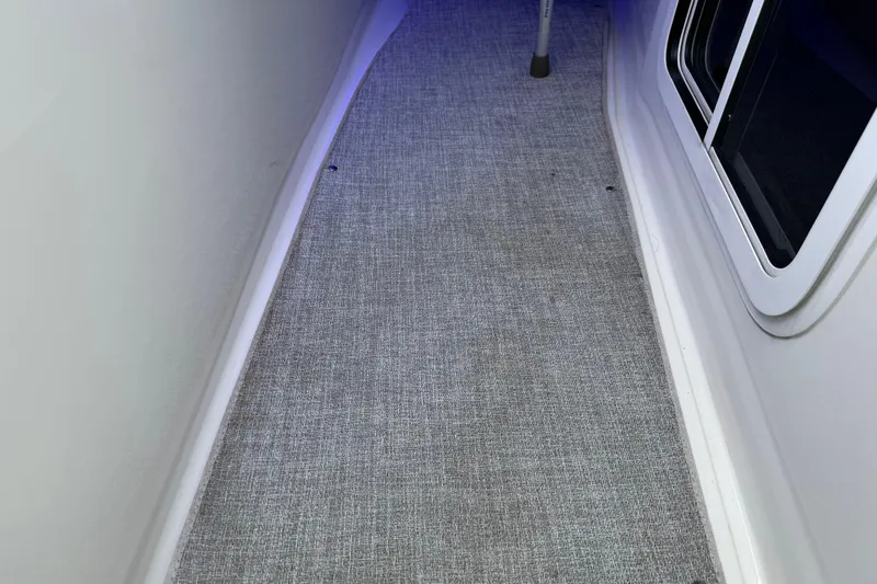 Slide: The Image of 2023 Formula 400 Super Sport Crossover interior walkway with carpet and window. - 91