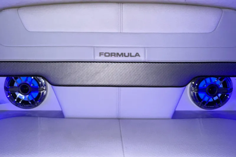 Slide: The Image of 2023 Formula 400 Super Sport Crossover interior with blue-lit speakers and sleek design. - 95