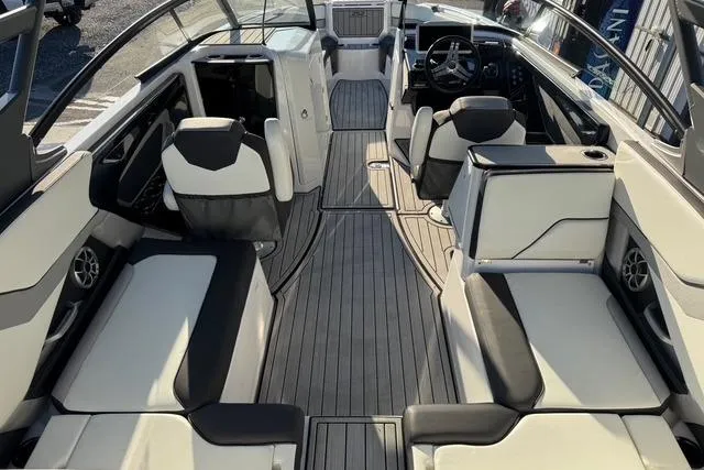 Slide: The Image of 2021 Yamaha Boats 252SE interior with sleek seating and modern dashboard design. - 11