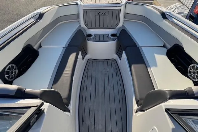 Slide: The Image of 2021 Yamaha Boats 252SE interior with sleek seating and modern design. - 17