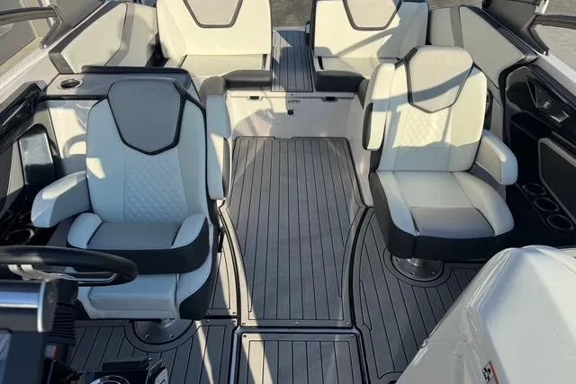 Slide: The Image of 2021 Yamaha Boats 252SE interior with modern seating and sleek design. - 5