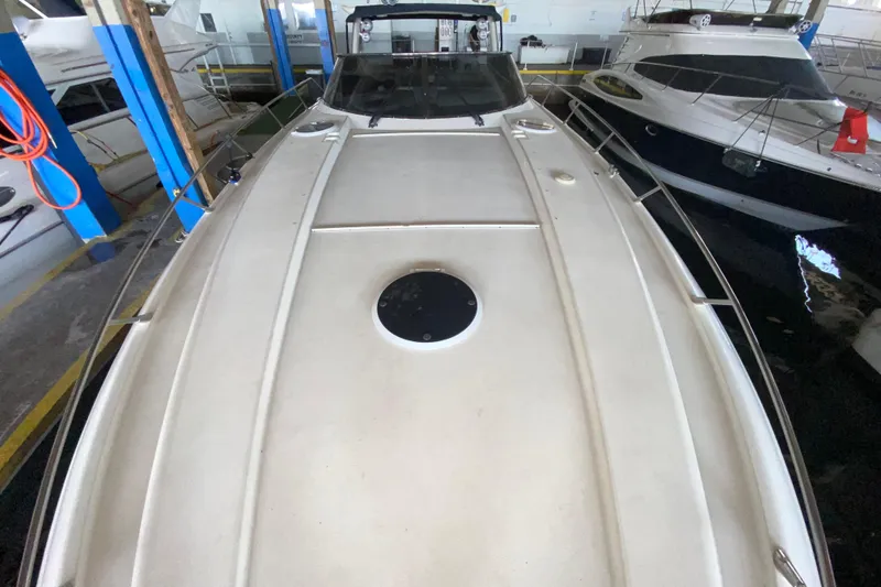 Slide: The Image of 1997 Sunseeker Camargue 51 yacht docked in a marina, top deck view. - 15