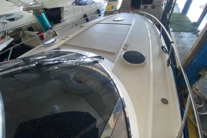 Slide: The Image of 1997 Sunseeker Camargue 51 yacht in storage, showcasing sleek deck design. - 20