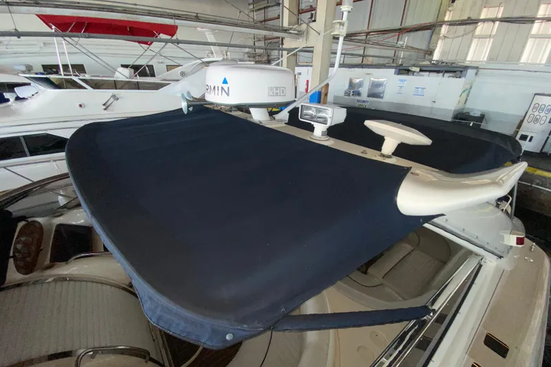 Slide: The Image of 1997 Sunseeker Camargue 51 yacht with radar and navigation equipment in a marina. - 23