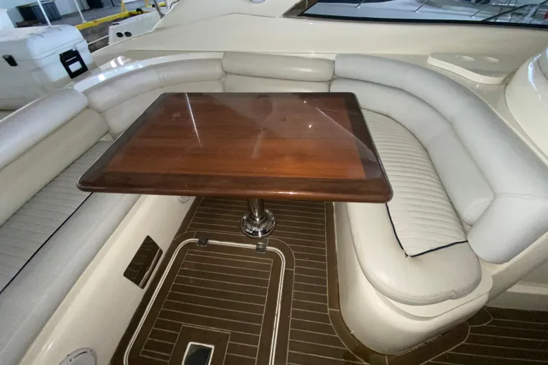 Slide: The Image of Interior of 1997 Sunseeker Camargue 51 yacht with wooden table and white seating. - 27