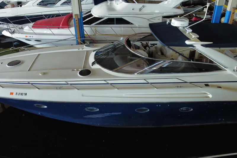 Slide: The Image of 1997 Sunseeker Camargue 51 yacht docked in a marina, side view. - 3