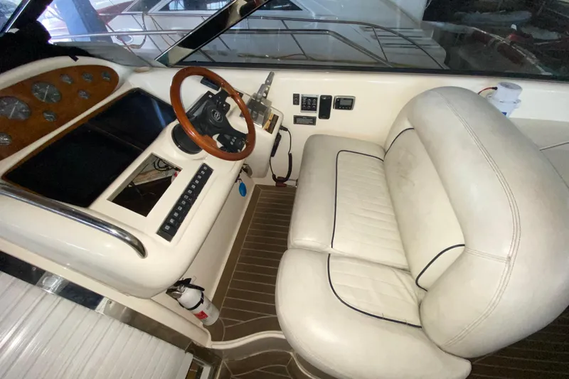 Slide: The Image of 1997 Sunseeker Camargue 51 helm with leather seating and wooden steering wheel. - 30