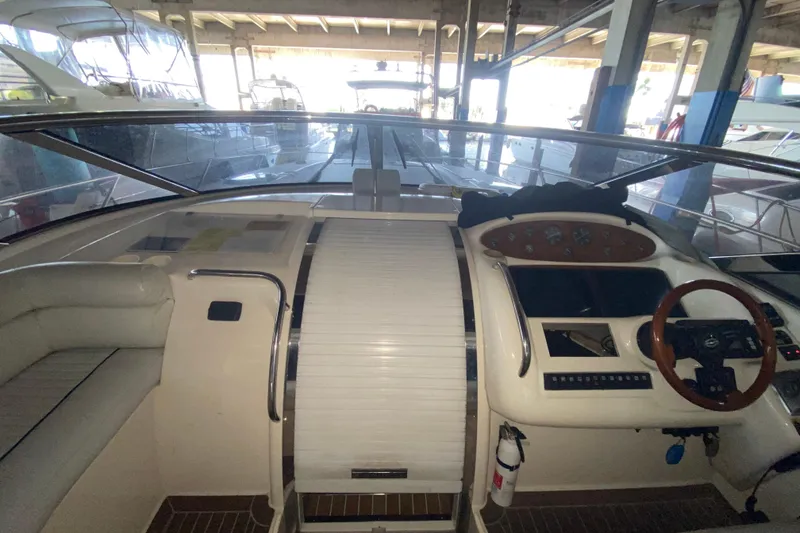 Slide: The Image of Interior view of 1997 Sunseeker Camargue 51 yacht cockpit with steering wheel. - 33