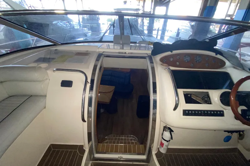 Slide: The Image of 1997 Sunseeker Camargue 51 yacht interior with helm and seating area. - 34