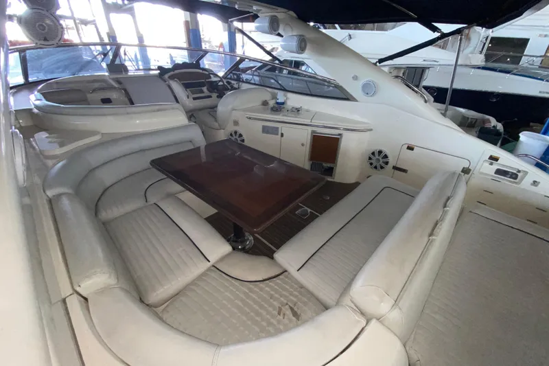 Slide: The Image of Interior of 1997 Sunseeker Camargue 51 yacht with plush seating and wooden table. - 35