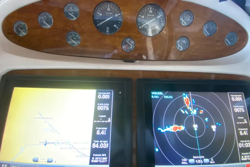 Slide: The Image of 1997 Sunseeker Camargue 51 dashboard with navigation and radar displays. - 37