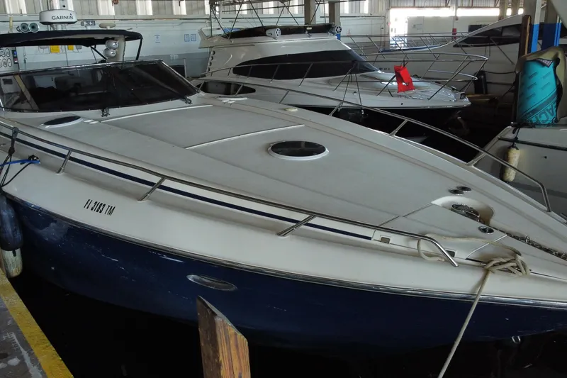 Slide: The Image of 1997 Sunseeker Camargue 51 yacht docked in a marina, showcasing sleek design and luxury features. - 5