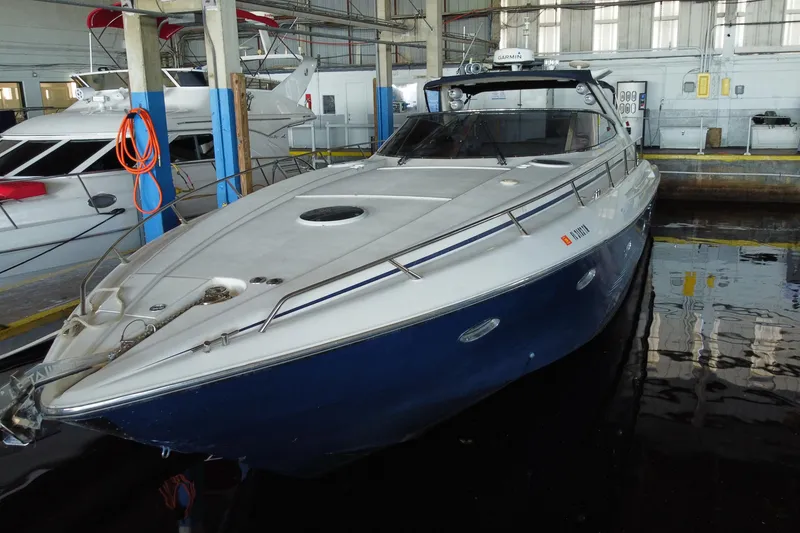 Slide: The Image of 1997 Sunseeker Camargue 51 yacht docked in a marina. - 6