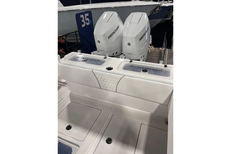 Slide: The Image of 2026 Contender 35 ST boat with dual Mercury engines, featuring a sleek white design. - 10