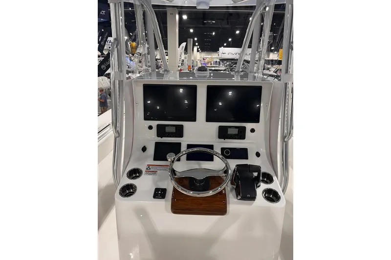Slide: The Image of 2026 Contender 35 ST boat console with dual screens and steering wheel. - 5