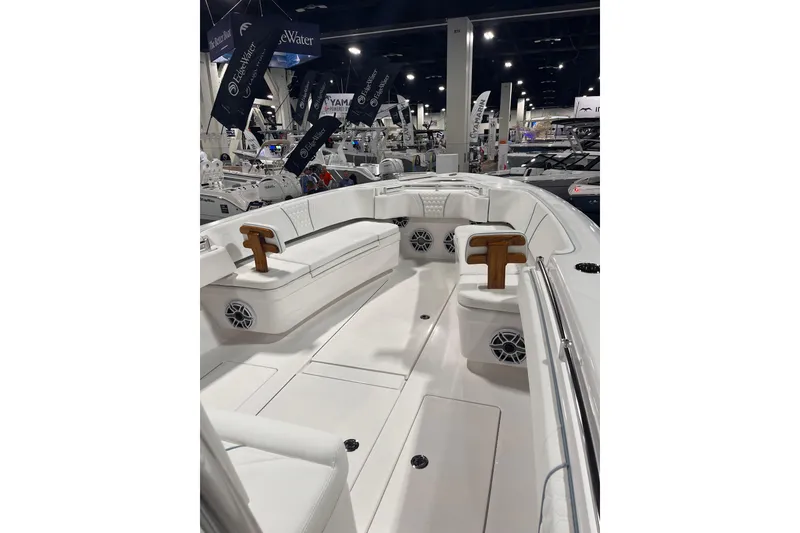 Slide: The Image of 2026 Contender 35 ST boat interior at a boat show, featuring seating and speakers. - 6