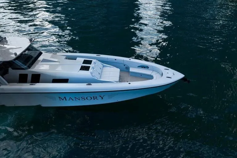 Slide: The Image of 2026 Midnight Express 52' Vitesse yacht on water, featuring sleek design and luxury seating. - 10