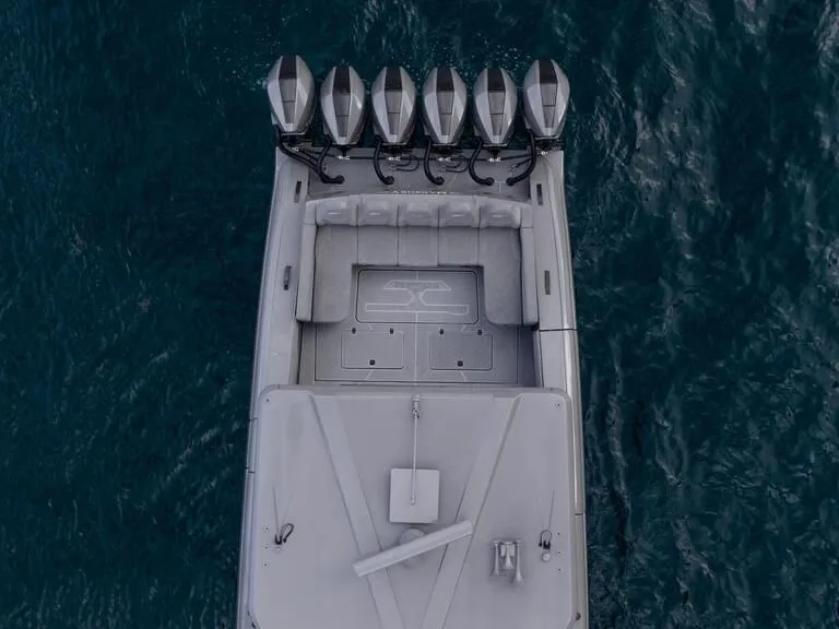 Slide: The Image of Aerial view of 2026 Midnight Express 52' Vitesse boat with six powerful engines. - 14