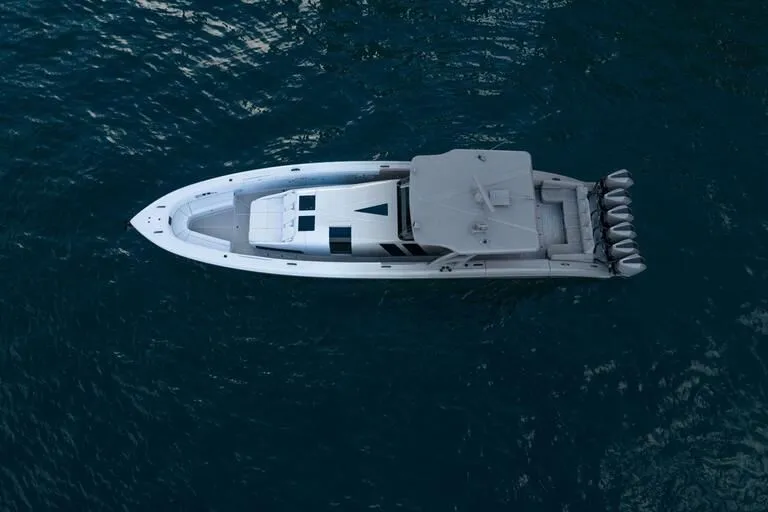Slide: The Image of Aerial view of 2026 Midnight Express 52' Vitesse yacht on open water. - 15