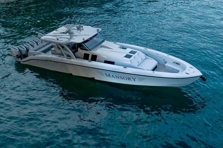 Slide: The Image of 2026 Midnight Express 52' Vitesse luxury boat on clear blue water. - 2