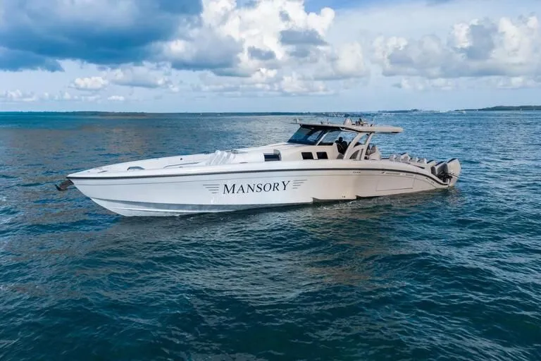 Slide: The Image of Luxurious 2026 Midnight Express 52' Vitesse yacht cruising on open water under a cloudy sky. - 3