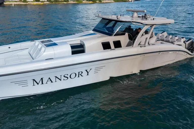 Slide: The Image of 2026 Midnight Express 52' Vitesse luxury yacht cruising on blue waters. - 4