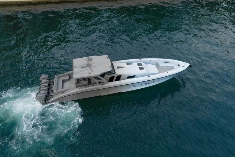 Slide: The Image of 2026 Midnight Express 52' Vitesse luxury boat cruising on water. - 5