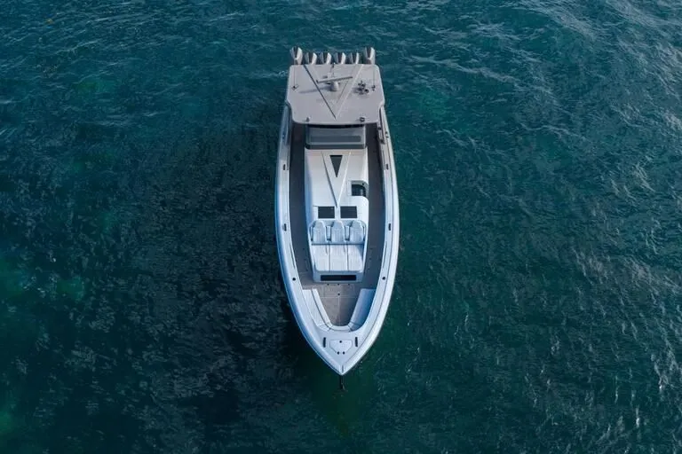 Slide: The Image of Aerial view of 2026 Midnight Express 52' Vitesse boat on open water. - 6