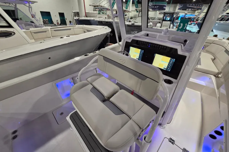 Slide: The Image of 2026 Sailfish 252 CC boat interior with dual displays and seating. - 23