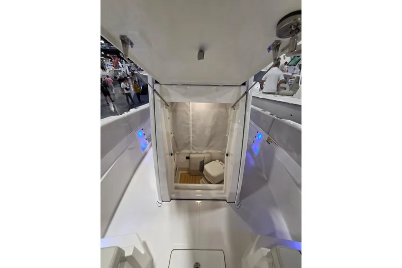 Slide: The Image of 2026 Sailfish 252 CC boat interior with open hatch and visible toilet. - 27