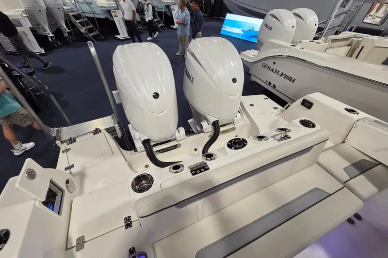 Slide: The Image of 2026 Sailfish 252 CC boat with dual Yamaha outboard engines at a boat show. - 29