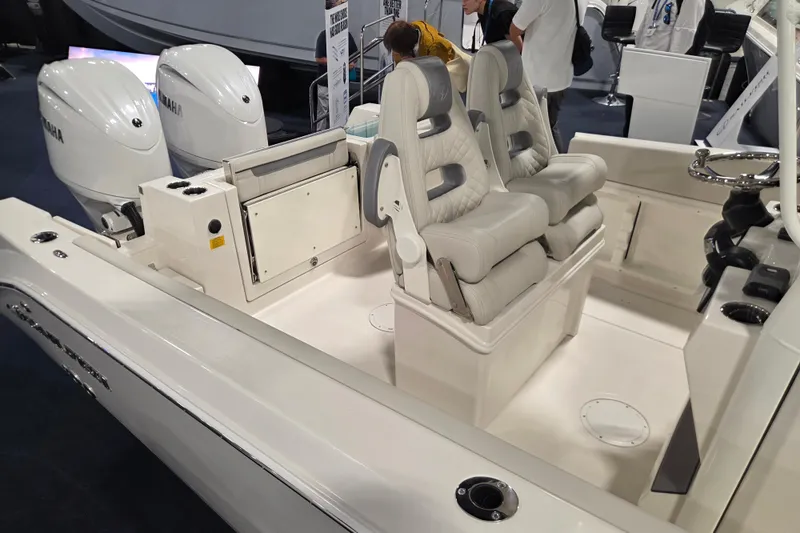 Slide: The Image of 2026 Sailfish 252 CC boat interior with dual Yamaha engines and luxurious seating. - 30