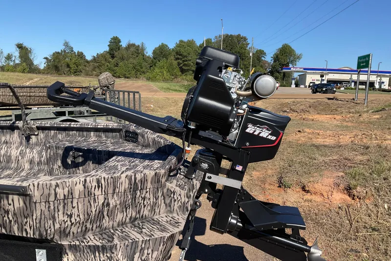 Slide: The Image of Havoc MSTC 2026 boat with powerful outboard motor, camo design, parked near a gas station. - 6