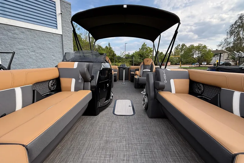 Slide: The Image of Luxurious 2026 Viaggio Z24U pontoon boat interior with tan and gray seating. - 14