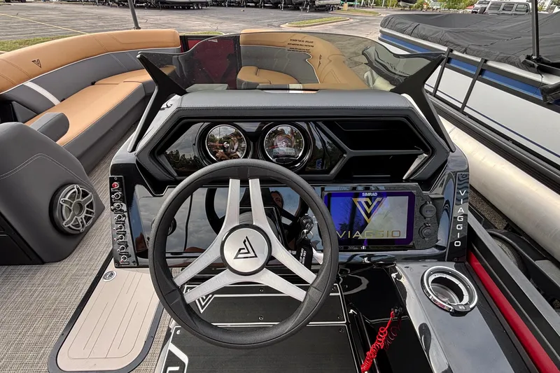 Slide: The Image of 2026 Viaggio Z24U boat dashboard with steering wheel and modern controls. - 19