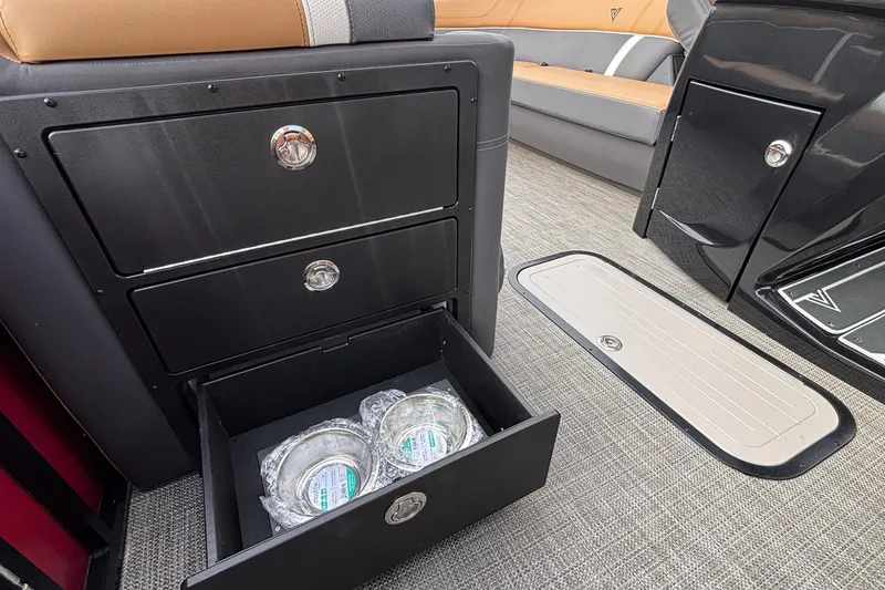 Slide: The Image of Interior of 2026 Viaggio Z24U with open storage drawer and seating. - 25