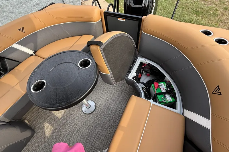 Slide: The Image of Luxurious Viaggio Z24U 2026 boat interior with tan seating, round table, and storage compartment. - 3