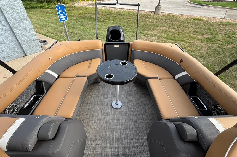 Slide: The Image of Luxurious seating area on 2026 Viaggio Z24U boat with round table and cup holders. - 5